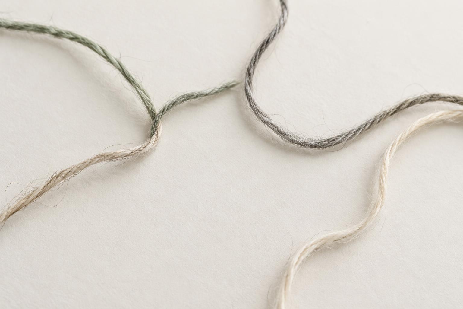 Loose threads meeting around an open space
